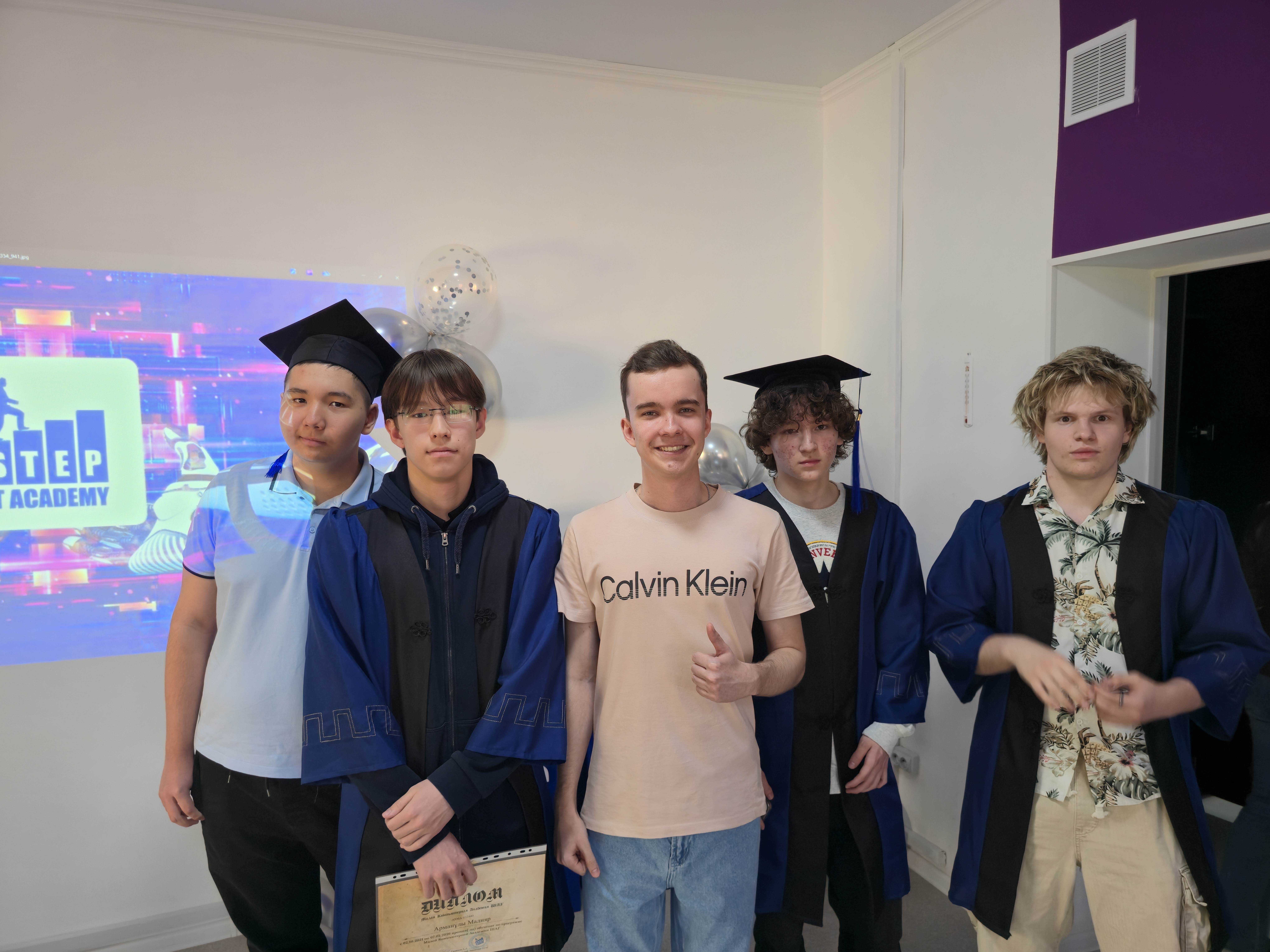Graduation ceremony at ITSTEP Academy with students in caps and gowns